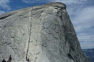 Hikers hiking Half Dome's cables by Matt Montagne